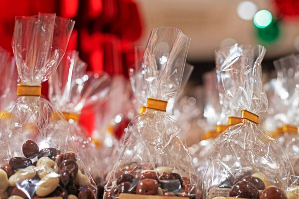 Chocolate-covered nuts wrapped in clear gift wrap