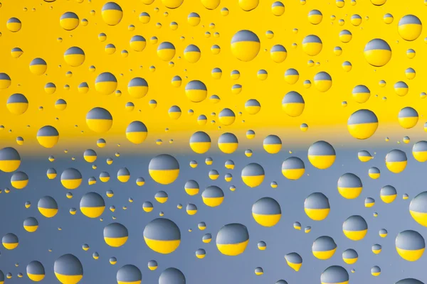 Blå och gula droppar — Stockfoto