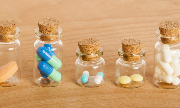 pills in glass jars