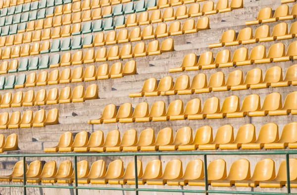 Yellow chairs on the soccer field — Stock Photo, Image