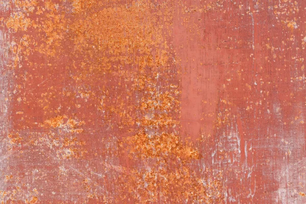 Zerkratzte orangefarbene Metalloberfläche — Stockfoto