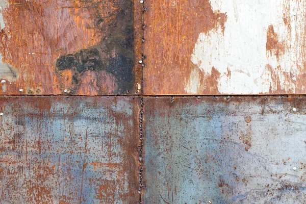 Scratched and rusty orange metal surface — Stock Photo, Image