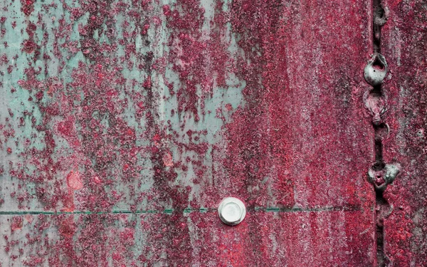 Scratched and rusty red metal surface — Stock Photo, Image