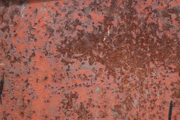 Scratched and rusty orange metal surface — Stock Photo, Image