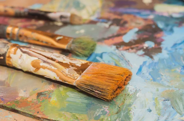 Paints brushes and oil paints Royalty Free Stock Images