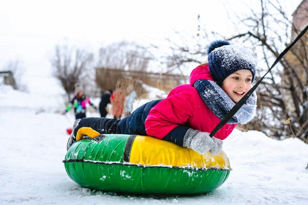 Happy Little Girl Slides Slide Snow Tube Tubing Winter Fun — Stock Photo, Image