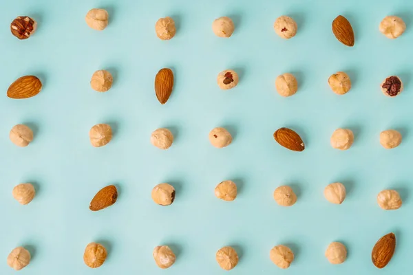 Creative Layout Nuts Hazelnuts Almonds Blue Background Top View Copy — Stock Photo, Image