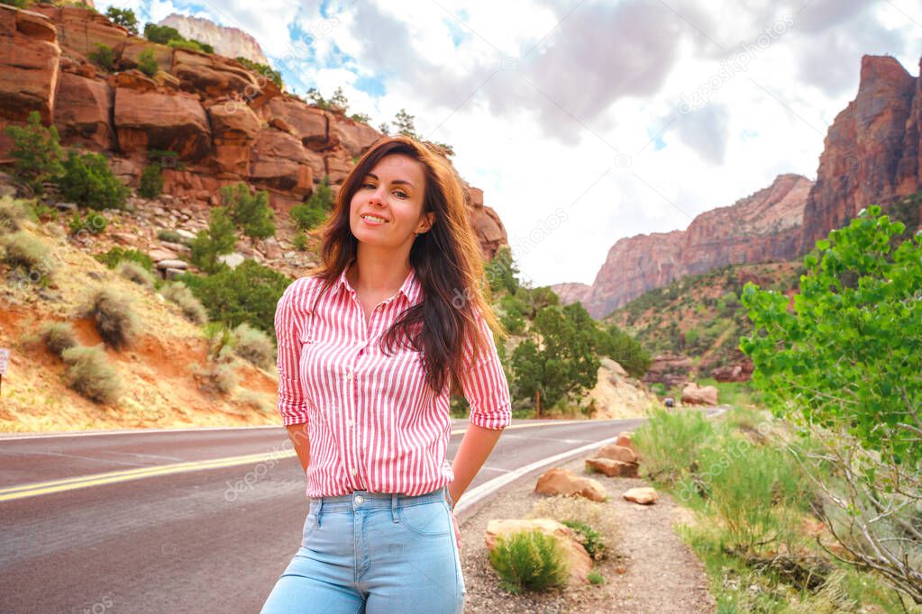 Beautiful woman in jeans in Zion National Park, Utah, USA