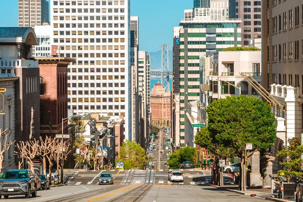 A street in the center of the city with a sloping road and a beautiful view of the downtown. San Francisco, USA - 17 Apr 2021