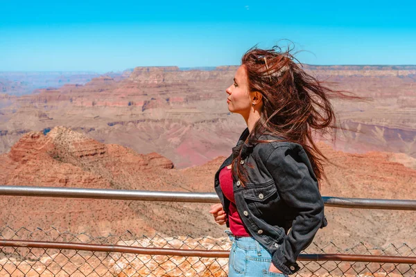 Female happy tourist at Grand Canyon, Arizona