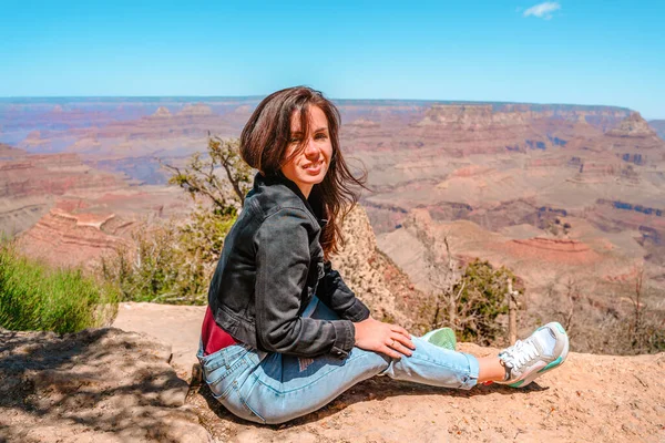 Female happy tourist at Grand Canyon, Arizona