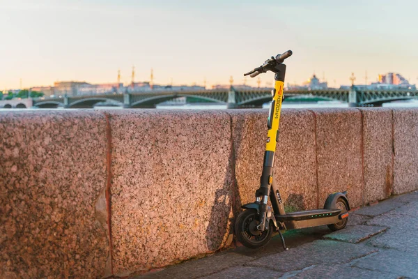 stock image Scooters for rent are on the streets of the city in the center in the summer. Saint Petersburg, Russia - 05 Apr 2021