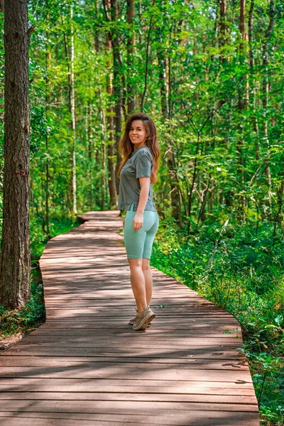 Young Athletic Woman Walks Pine Summer Forest — Stock Photo, Image