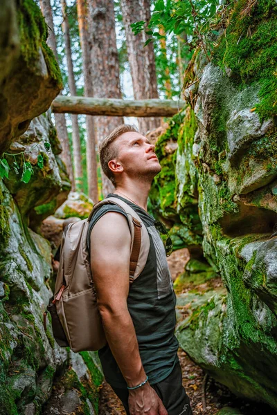 Young Man Hiking Pine Forest Huge Rocks Covered Moss — Stock Photo, Image