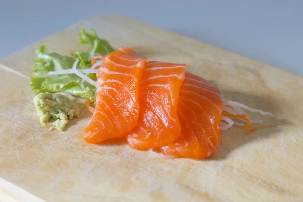 Fresh sashimi saimon on wood background — Stock Photo, Image