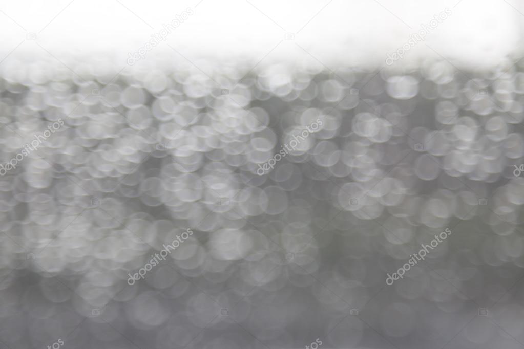 Abstract raindrop and bokeh on windshield
