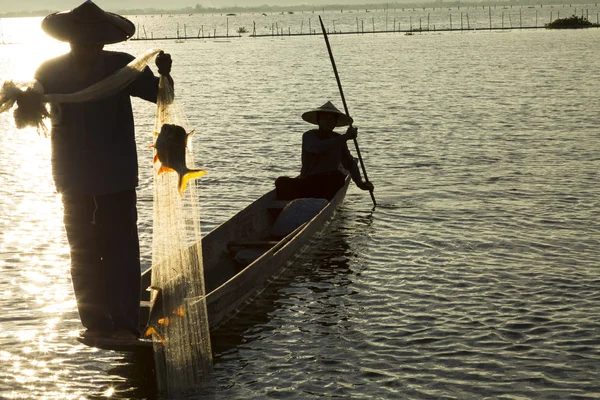 Fishermen in lake — Stock Photo, Image