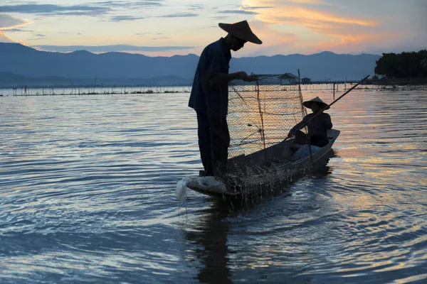 Fishermen in lake — Stock Photo, Image