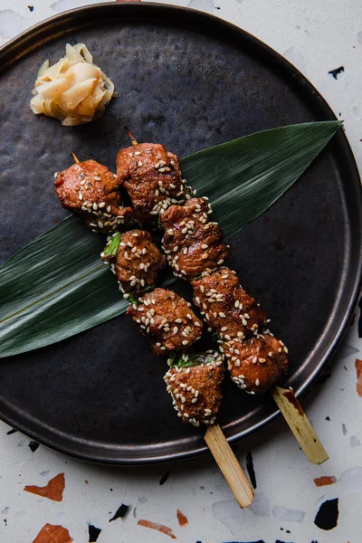 Closeup View Grilled Kebab Skewer Green Leaves — Stok Foto