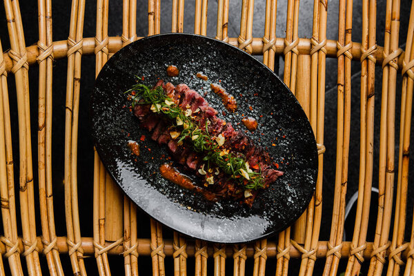 Top View Delicious Pieces Beef Sauce Black Plate Stock Picture