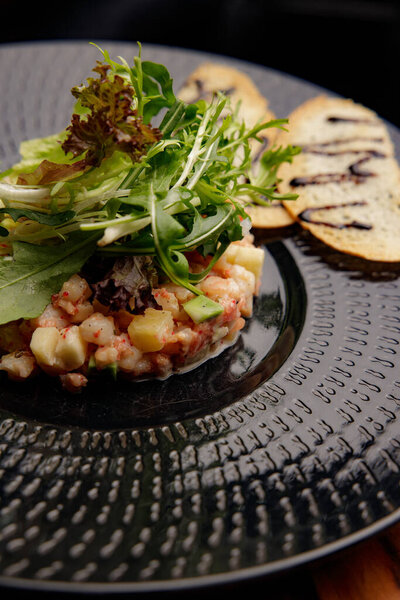 Closeup View Fresh Salad Vegetables Shrimps Black Plate Stock Image