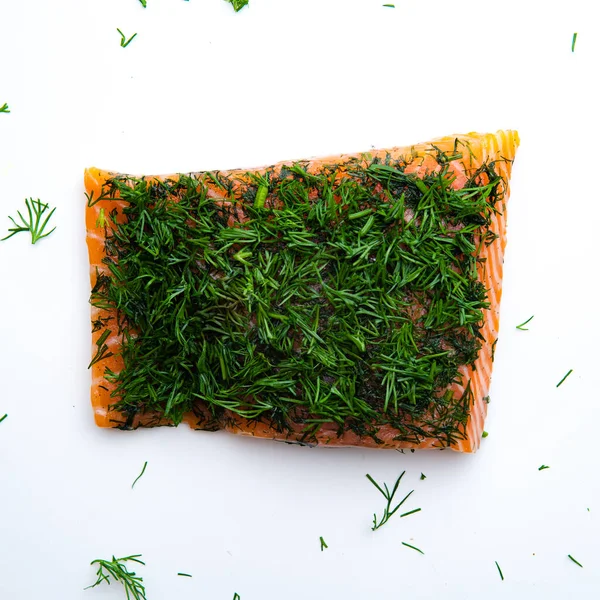 top view of red fish fillet with spices isolated on white background