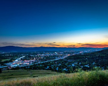 Sunset in the mountains overlooking Missoula Montana clipart