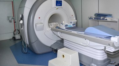 magnetic resonance imaging and examination of patients on it  clipart