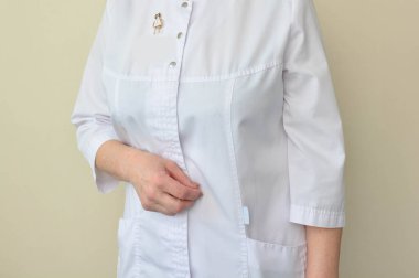 doctor or nurse in a white medical coat 