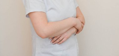 doctor or nurse in a white medical coat 