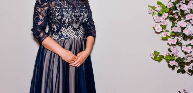 woman in an elegant dress made of thin or transparent fabric 