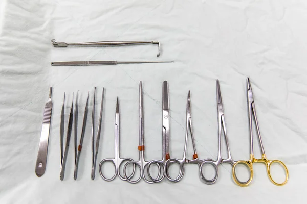 Tools for surgery on white fabric, Preparation for surgery, Surgical tools in operating room