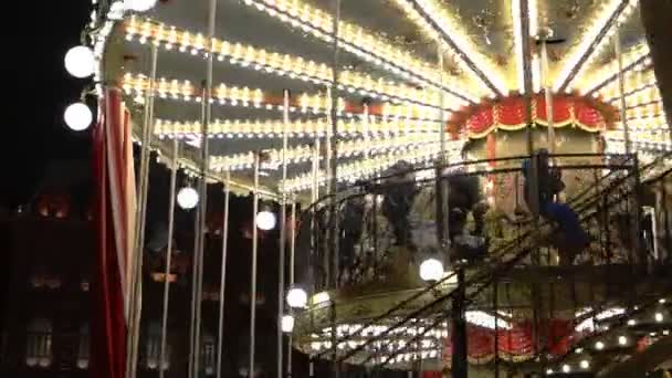 Adults with children ride the rides during the New Year period — Stock Video