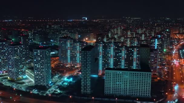 Night lights of a sleeping area in a large modern metropolis from a birds eye view. aerial view. artistic noise — Stock Video