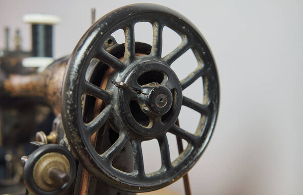 Close-up of a vintage hand sewing machine. Selective focus.