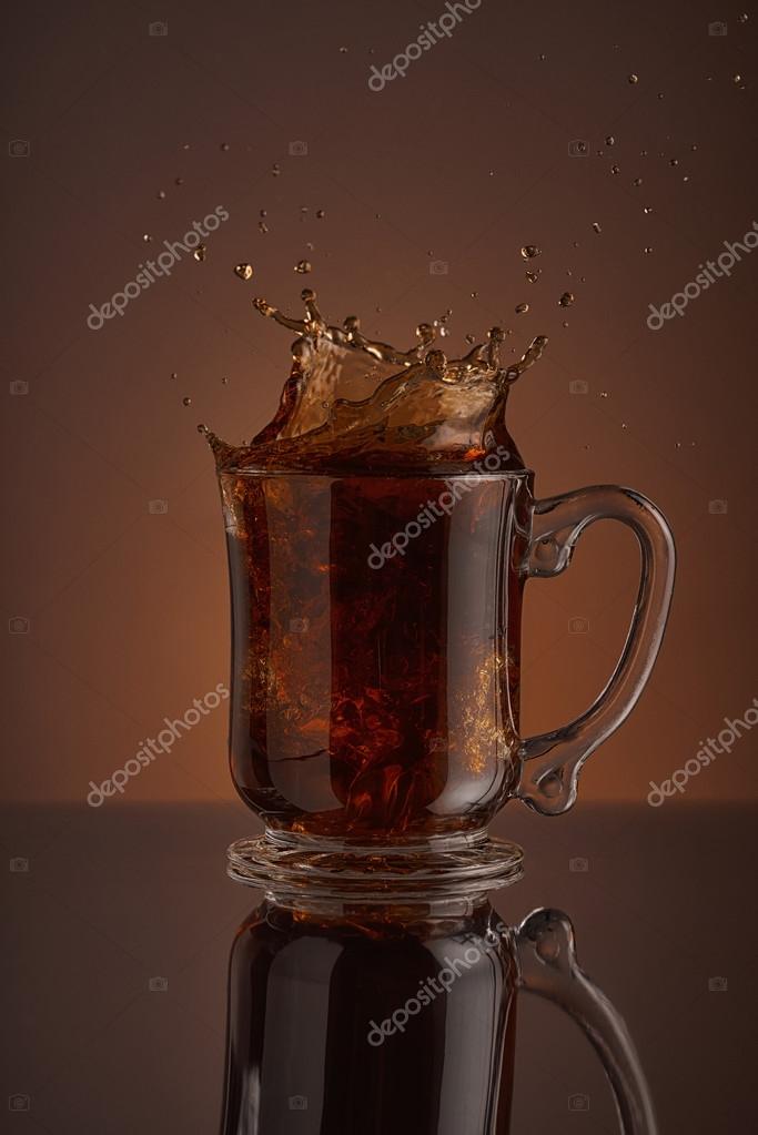 https://st2.depositphotos.com/3361813/7792/i/950/depositphotos_77920472-stock-photo-splash-black-ice-coffee-drink.jpg