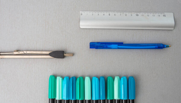 school supplies on grey desk ,concept of back to school .