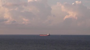 A ship lying in the roadstead near Novorossiysk on the Black Sea in Russia Words