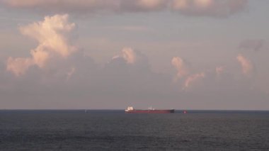 A ship lying in the roadstead near Novorossiysk on the Black Sea in Russia Words