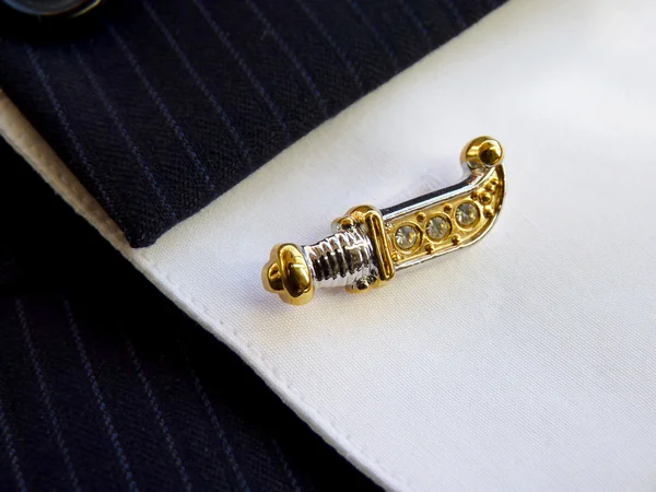 Cuff link in the form of the Ancient knife — Stock Photo, Image