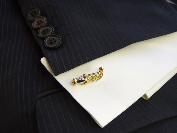 Cuff link in the form of the Ancient knife — Stock Photo, Image