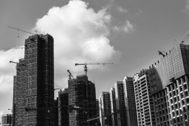 Black and white image of skyscrappers construction clipart