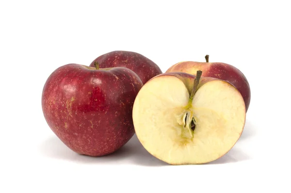 Närbild av röda äpplen isolerade över vita Stockbild