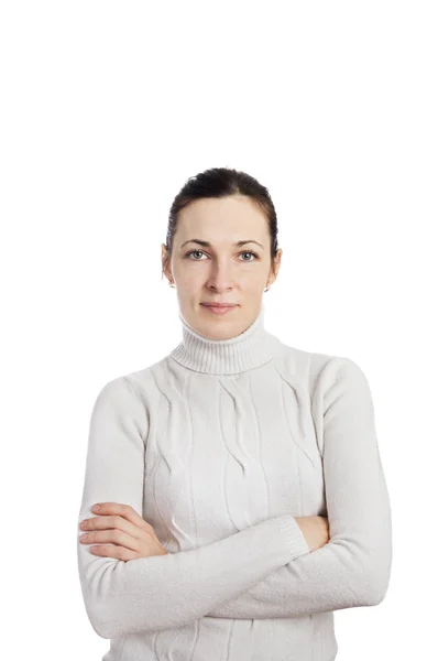 Retrato de una mujer con suéter blanco posando con brazos acros Imagen de stock