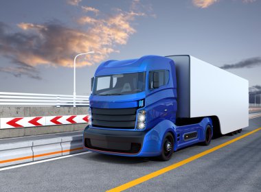 Autonomous hybrid truck driving on highway clipart