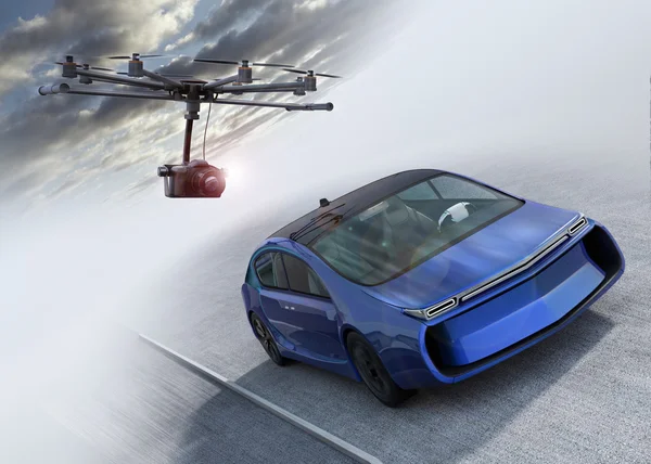 Octocopter following a car for shooting film — Stock Photo, Image