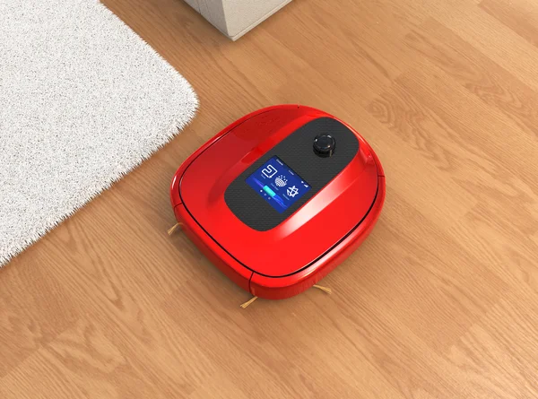 Red robotic vacuum cleaner moving on flooring — Stock Photo, Image