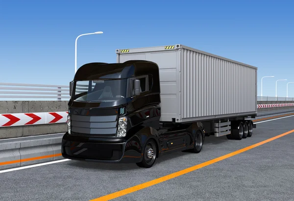Černá kontejner kamion na dálnici — Stock fotografie