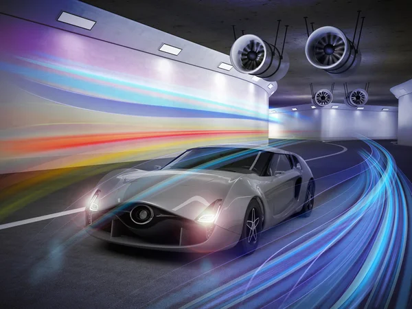 Stříbrný sportovní automobil s barevnými světlé stezky v tunelu — Stock fotografie