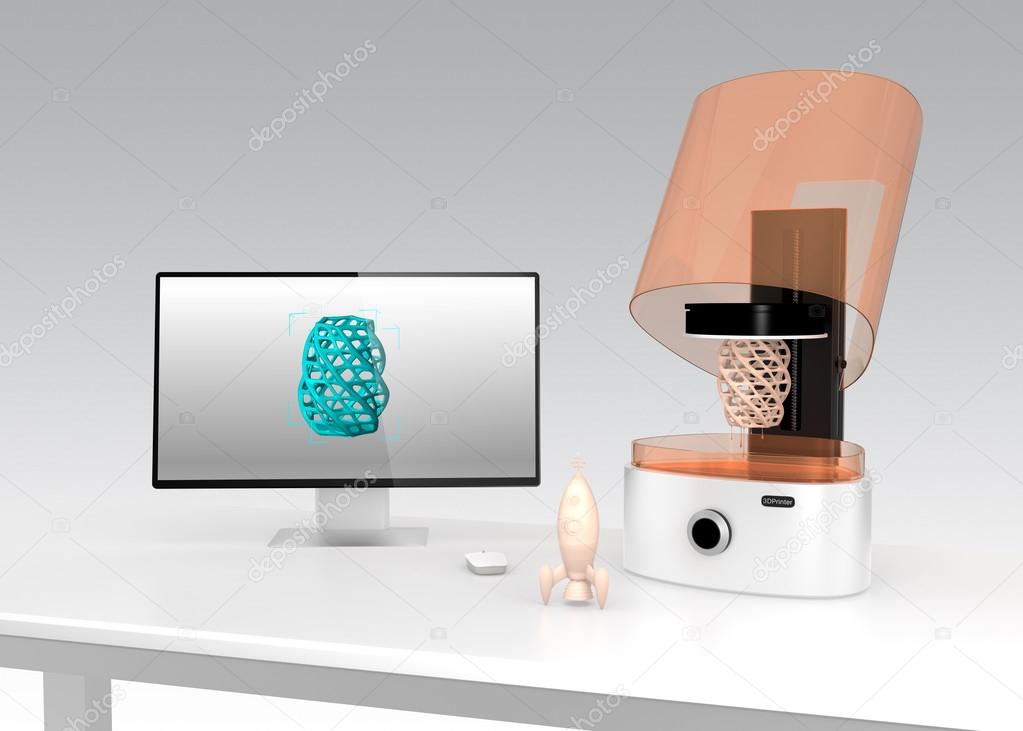 SLA  3D printer and desktop computer on a table
